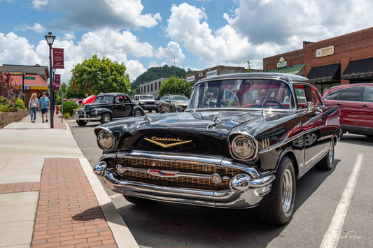 Vintage Chevrolet parked in West Jefferson, North Carolina during a Cruise-In event with spectators and classic cars in the background.