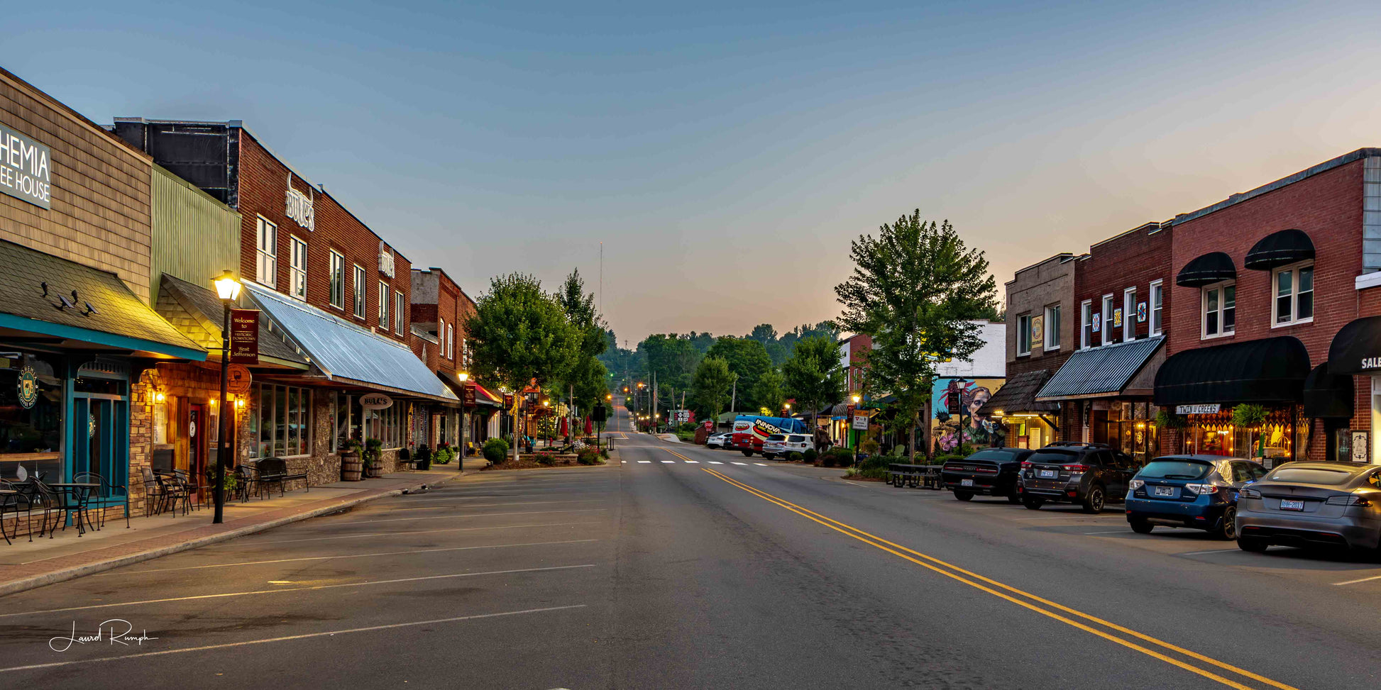 Westward facing view of Jefferson st. in downtown West Jefferson, North Carolina, early in the blue hour, featuring bohemia, Bulls and naked creek farmacy.
