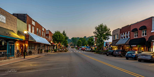 Westward facing view of Jefferson st. in downtown West Jefferson, North Carolina, early in the blue hour, featuring bohemia, Bulls and naked creek farmacy.
