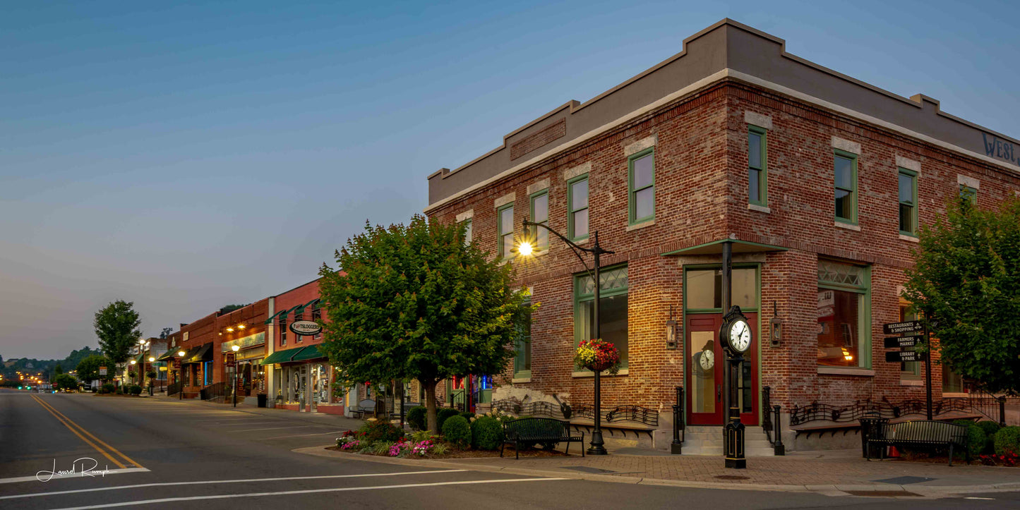 View of West Jefferson, North Carolina, just before sunrise, looking like a charming, small mountain town, with the old historic hotel in the foreground.