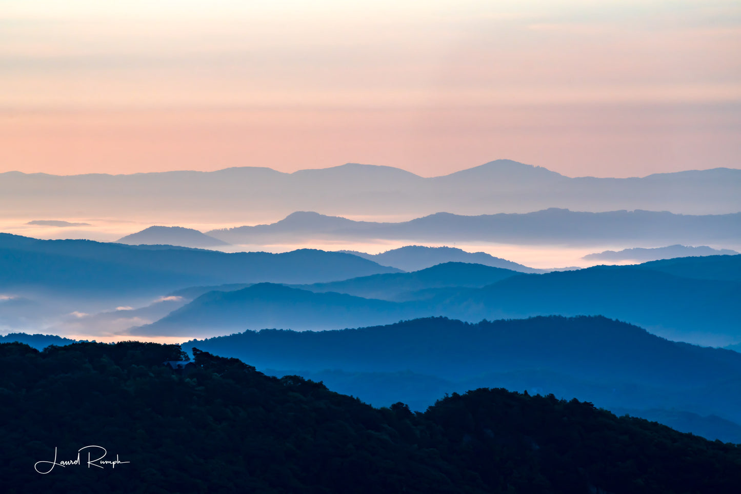 View from Thunder hill overlook near Blowing Rock, North Carolina, of iconic blue ridge mountains, because of daylight hour, mountains are blue and white. 2x3 crop