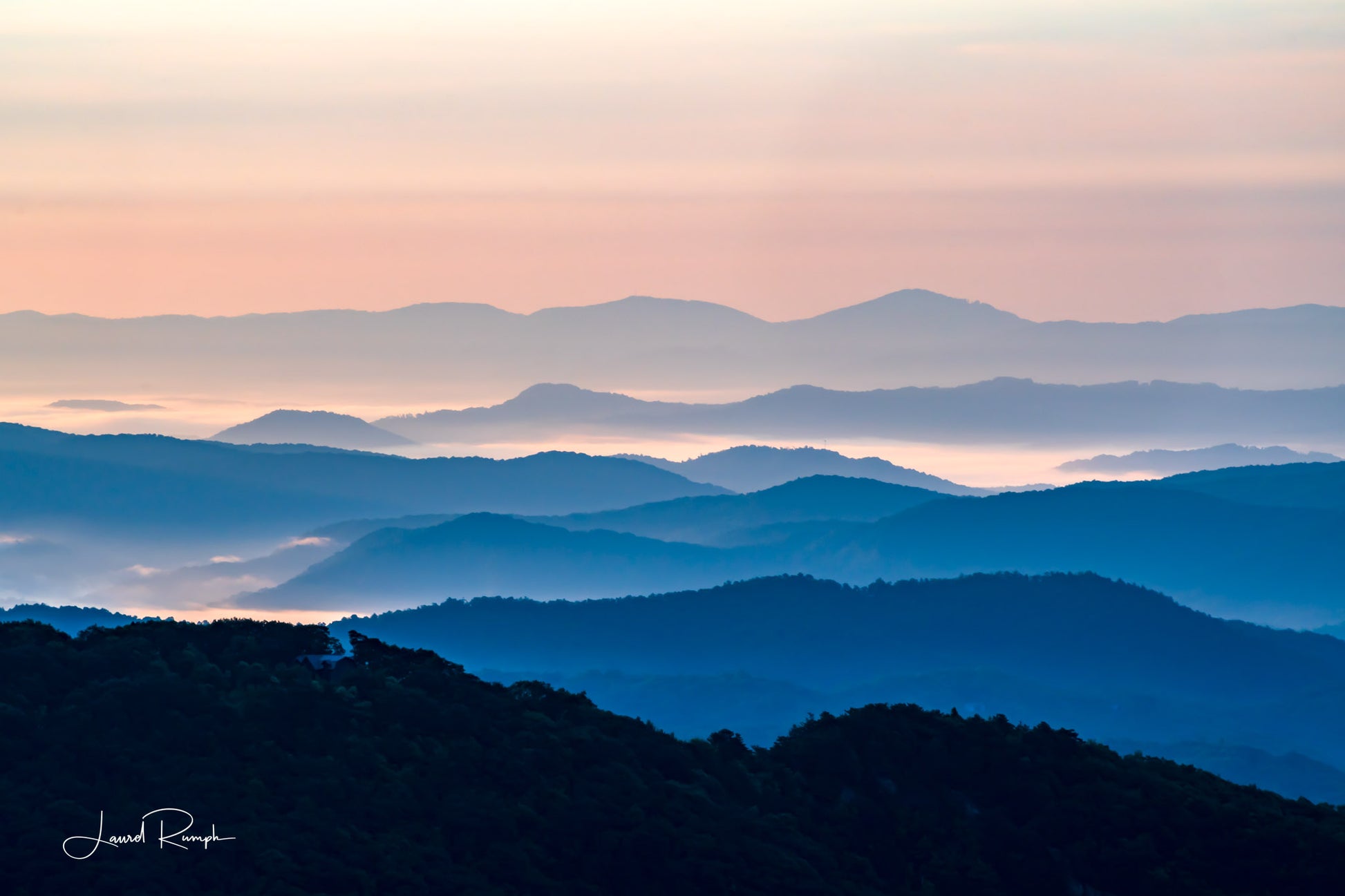 View from Thunder hill overlook near Blowing Rock, North Carolina, of iconic blue ridge mountains, because of daylight hour, mountains are blue and white. 2x3 crop