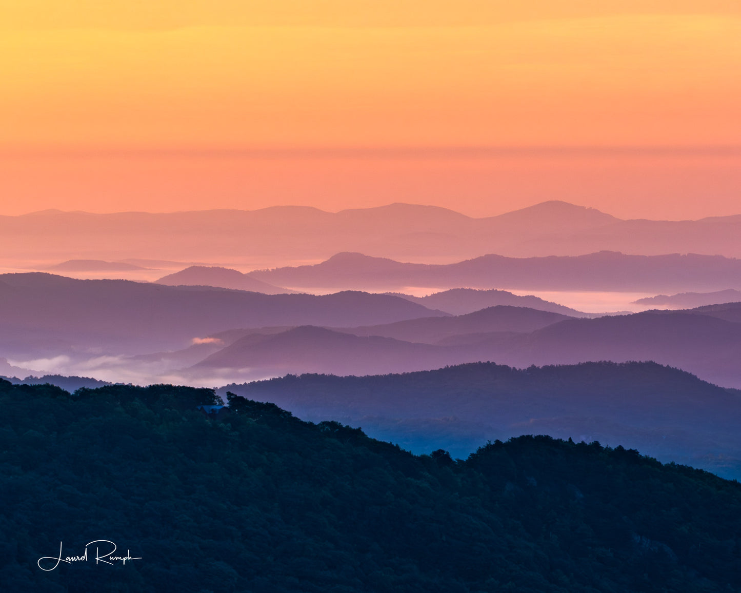View from Thunder hill overlook near Blowing Rock, North Carolina, of iconic blue ridge mountains, but because of golden hour, mountains are orange and purple instead of blue and white. 4x5 crop