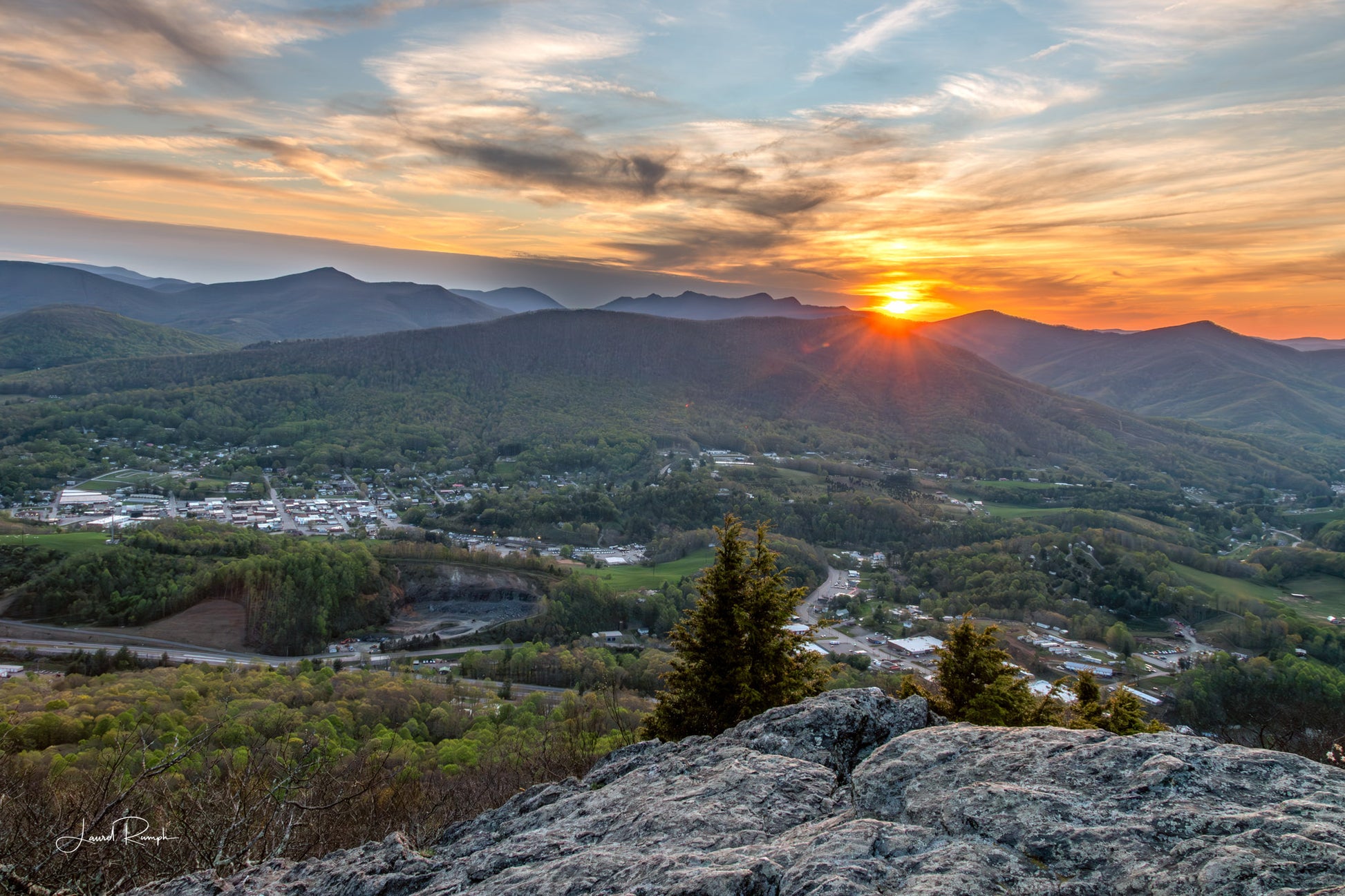 View from the Jefferson overlook on top of Mt Jefferson, with West Jefferson, North Carolina, in view and three top mountain in the background, at sunset. 2x3 crop
