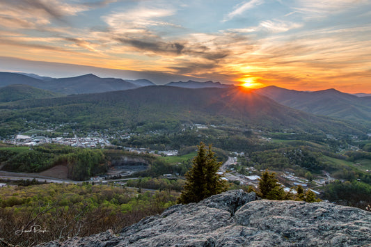 View from the Jefferson overlook on top of Mt Jefferson, with West Jefferson, North Carolina, in view and three top mountain in the background, at sunset. 2x3 crop
